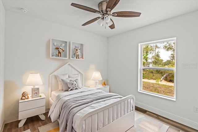 bedroom featuring ceiling fan and hardwood / wood-style floors