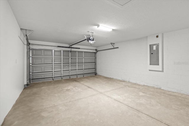 garage featuring electric panel and a garage door opener