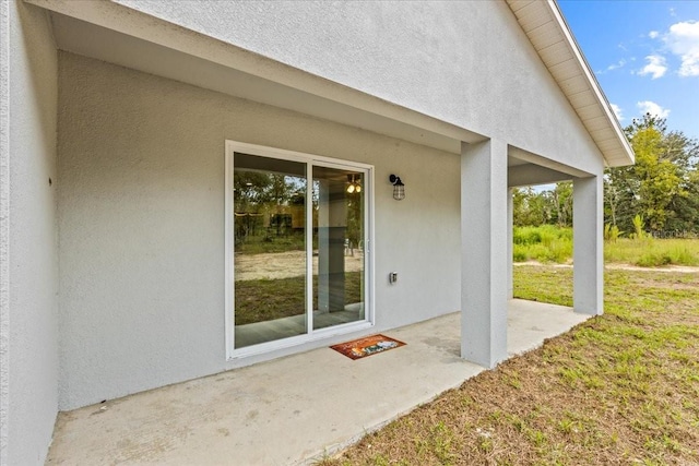 doorway to property featuring a patio