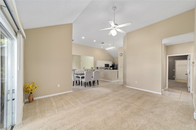 living room with ceiling fan, recessed lighting, light colored carpet, baseboards, and vaulted ceiling