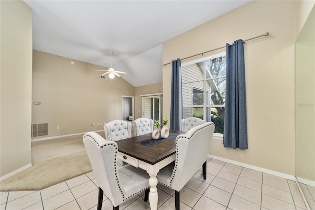 dining area featuring lofted ceiling, visible vents, baseboards, and light tile patterned floors