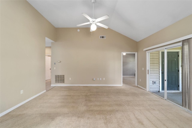 carpeted empty room with high vaulted ceiling and ceiling fan