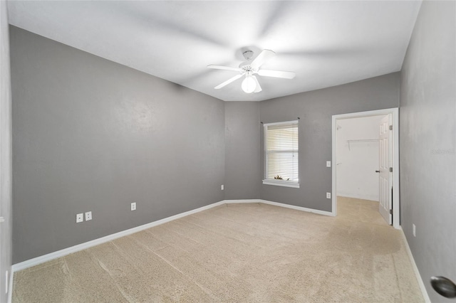 unfurnished room with ceiling fan, carpet floors, and baseboards