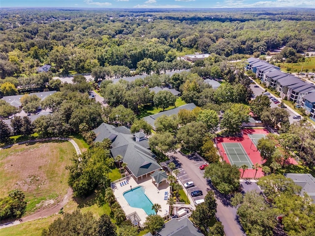 drone / aerial view with a view of trees