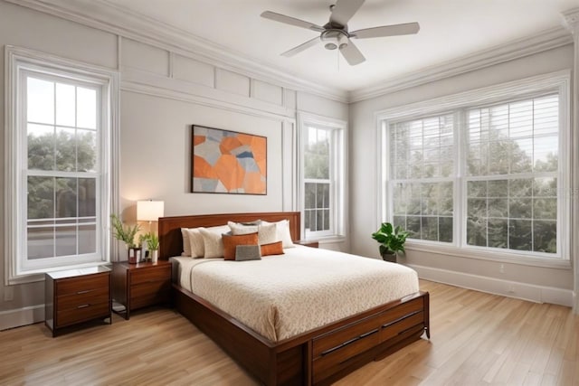 bedroom featuring crown molding, ceiling fan, multiple windows, and light hardwood / wood-style floors