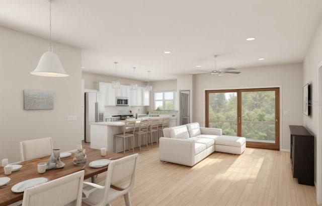 living room featuring light wood-type flooring and ceiling fan