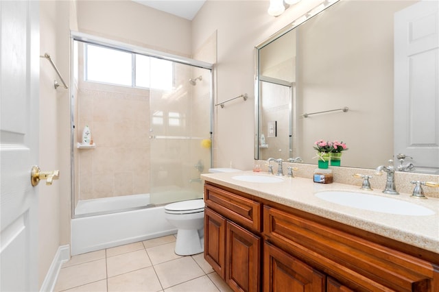 full bathroom with tile patterned flooring, toilet, combined bath / shower with glass door, and vanity