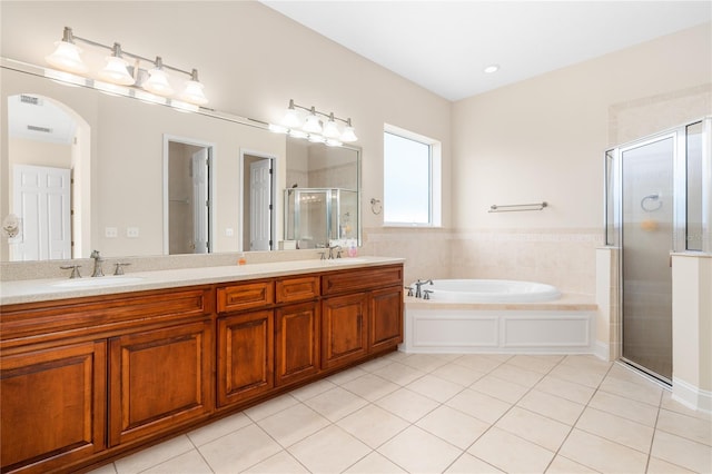 bathroom with vanity, independent shower and bath, and tile patterned floors