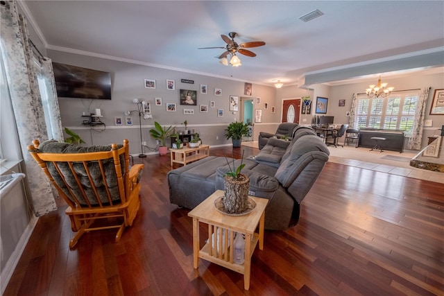 living room featuring crown molding, ceiling fan with notable chandelier, and hardwood / wood-style flooring