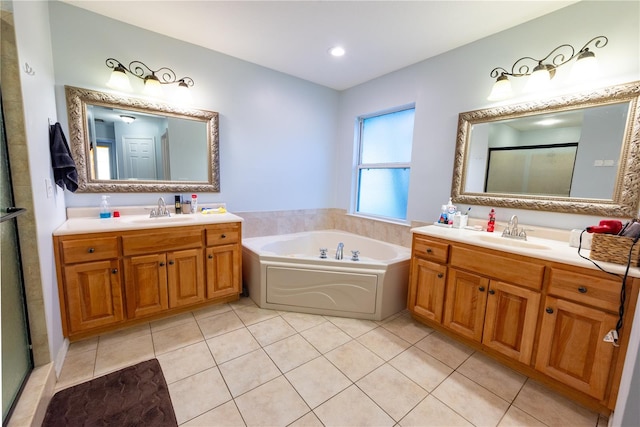 bathroom featuring plus walk in shower, tile patterned flooring, and vanity