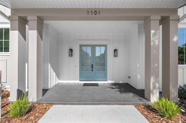 1101 SW 136th St, Newberry, FL 32669 - entrance to property featuring board and batten siding and french doors