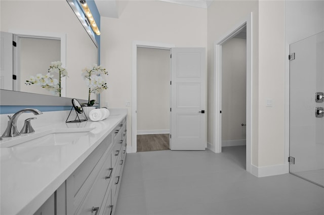 1101 SW 136th St, Newberry, FL 32669 - full bath with a shower stall, baseboards, a sink, and double vanity