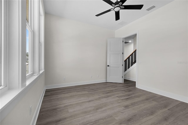 1101 SW 136th St, Newberry, FL 32669 - empty room with wood finished floors, baseboards, a ceiling fan, and visible vents