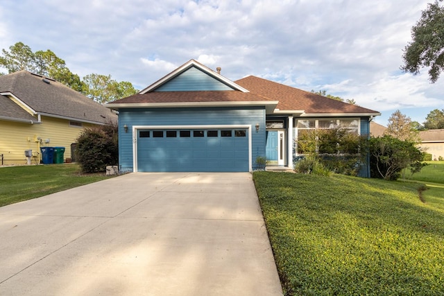 view of front facade featuring a front lawn and a garage