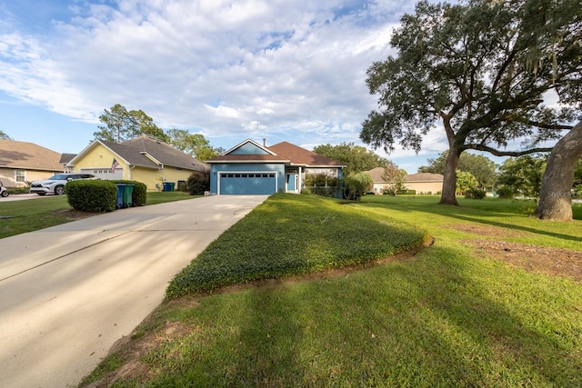 view of front of property featuring a garage and a front yard