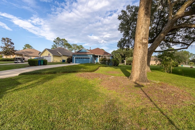 view of front facade featuring a front yard and a garage