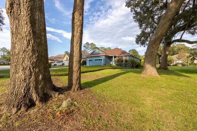 view of yard with a garage