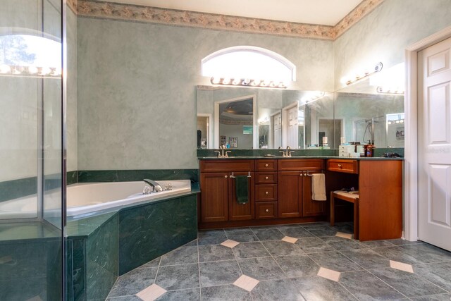 bathroom with vanity, tile patterned floors, and plus walk in shower