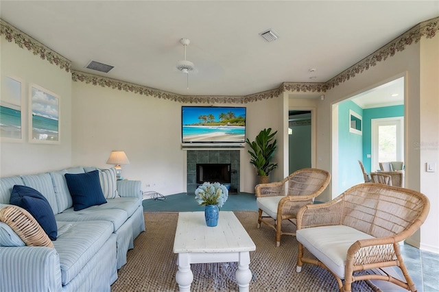 11509 NW 67th Ter, Alachua, FL 32615 - living room with visible vents and a fireplace
