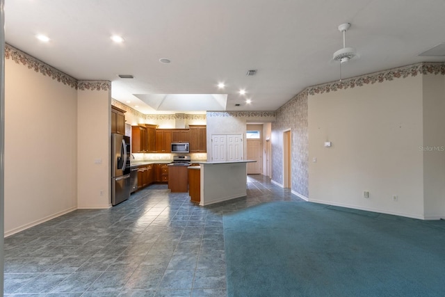11509 NW 67th Ter, Alachua, FL 32615 - kitchen featuring open floor plan, visible vents, stainless steel appliances, and baseboards