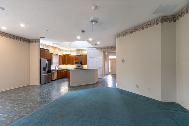 11509 NW 67th Ter, Alachua, FL 32615 - kitchen with stainless steel appliances, visible vents, a kitchen island, baseboards, and open floor plan