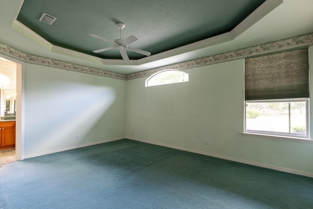 11509 NW 67th Ter, Alachua, FL 32615 - carpeted spare room with a raised ceiling, visible vents, a ceiling fan, ornamental molding, and baseboards