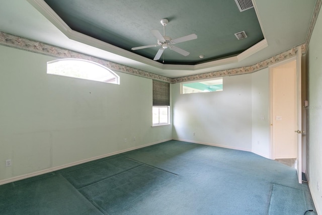 11509 NW 67th Ter, Alachua, FL 32615 - carpeted spare room featuring visible vents, a raised ceiling, a ceiling fan, and crown molding