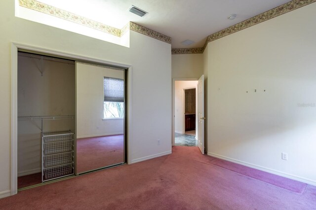 11509 NW 67th Ter, Alachua, FL 32615 - unfurnished bedroom with baseboards, visible vents, carpet, and a closet