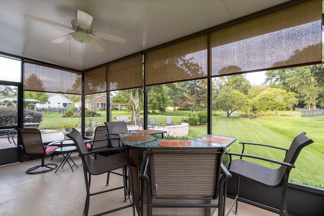 11509 NW 67th Ter, Alachua, FL 32615 - sunroom featuring outdoor dining area and a ceiling fan