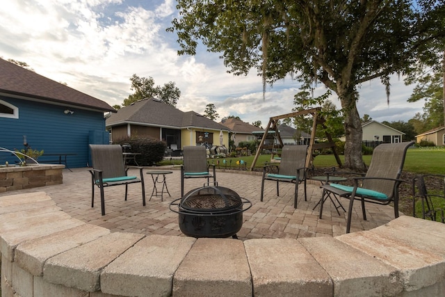11509 NW 67th Ter, Alachua, FL 32615 - view of patio with a fire pit and a residential view