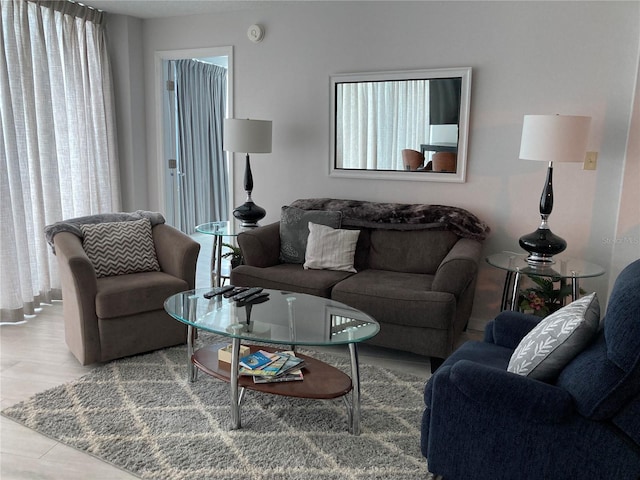 tiled living room with a healthy amount of sunlight