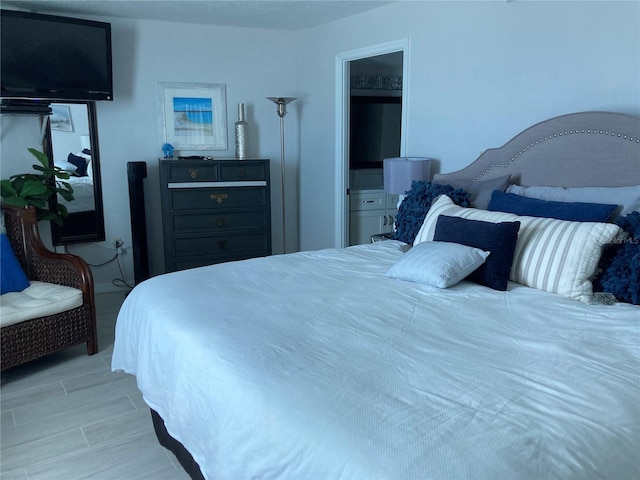 bedroom with light hardwood / wood-style floors