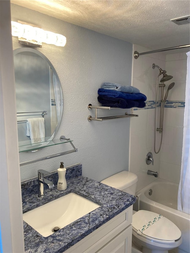 full bathroom with a textured ceiling, shower / bath combo with shower curtain, vanity, and toilet