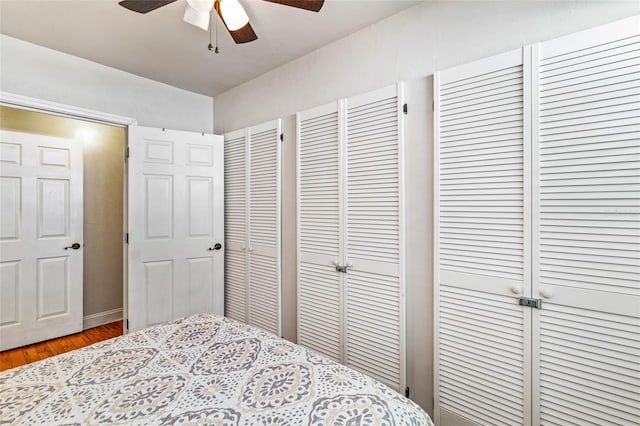 bedroom with wood finished floors and a ceiling fan