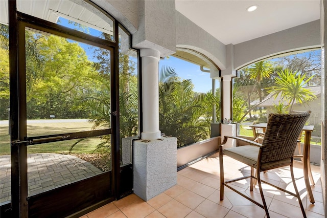 sunroom / solarium with decorative columns