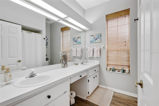 bathroom with vanity and hardwood / wood-style floors