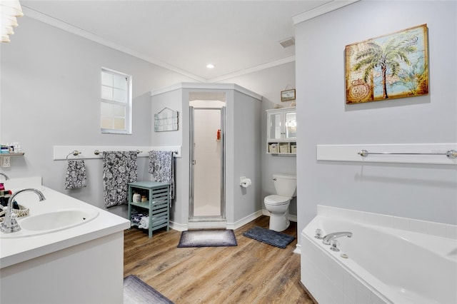 full bathroom with independent shower and bath, toilet, wood-type flooring, and vanity