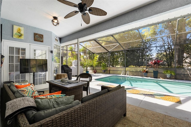 view of swimming pool featuring a lanai, ceiling fan, an outdoor hangout area, and a patio