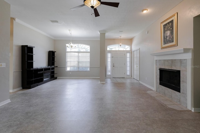 unfurnished living room with ceiling fan, ornamental molding, and a fireplace