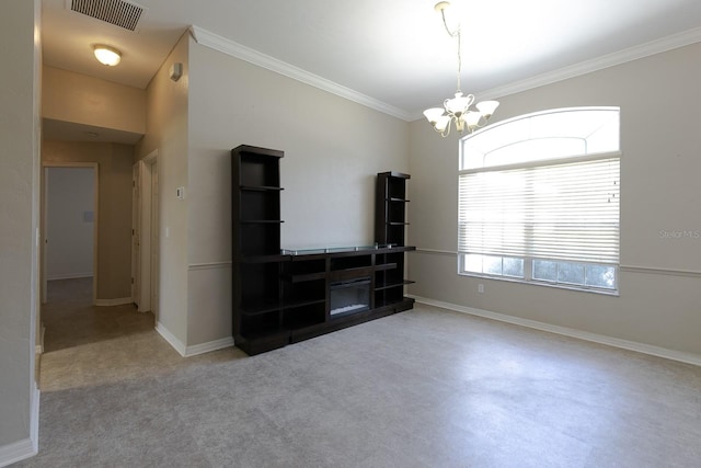 carpeted empty room with crown molding and a chandelier