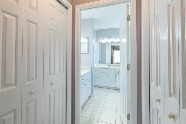 bathroom with tile patterned flooring and vanity