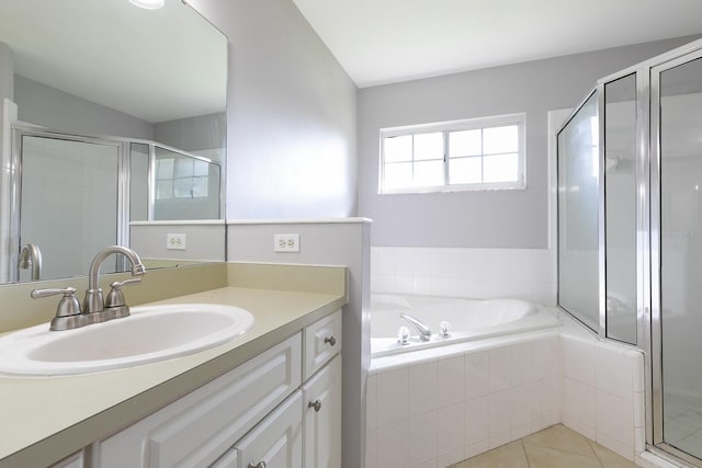 bathroom with tile patterned flooring, vanity, and independent shower and bath