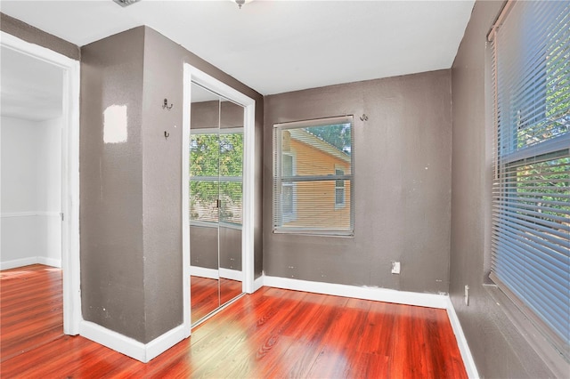 unfurnished room featuring hardwood / wood-style floors