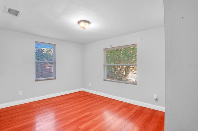 spare room featuring hardwood / wood-style floors