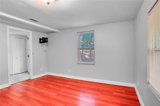 spare room featuring hardwood / wood-style floors