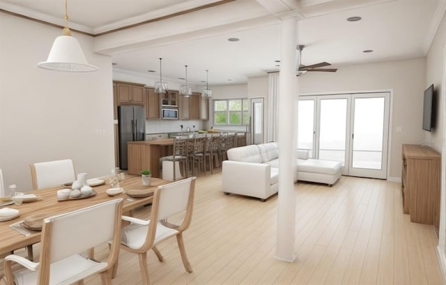 dining space with ceiling fan, ornamental molding, and light hardwood / wood-style flooring