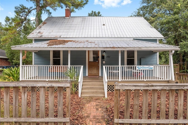 farmhouse-style home featuring a porch