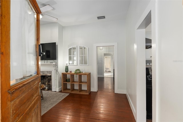 hallway featuring dark hardwood / wood-style floors