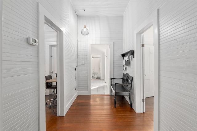 corridor with dark hardwood / wood-style floors