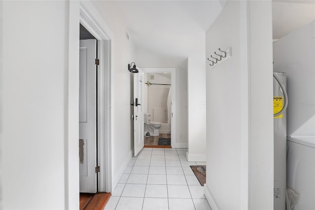 hall featuring light tile patterned floors